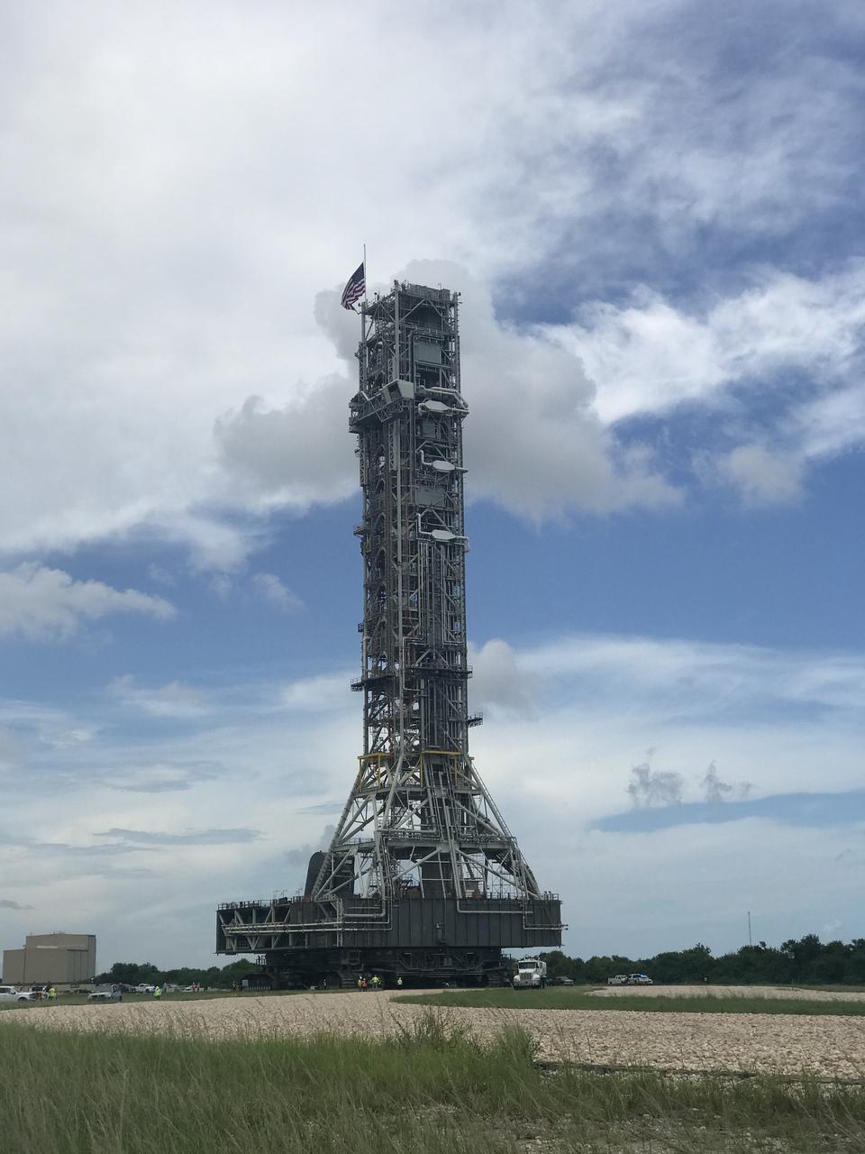 NASA's mobile launcher (ML) atop crawler-transporter 2 begins its trek to Launch Pad 39B on Aug. 30, 2018, at the agency's Kennedy Space Center in Florida. The ML will undergo a fit check on the surface of the pad, followed by several days of systems testing. The 380-foot-tall mobile launcher is equipped with the crew access arm and several umbilicals that will provide power, environmental control, pneumatics, communication and electrical connections to NASA's Space Launch System (SLS) and Orion spacecraft. Exploration Ground Systems is preparing the ground systems necessary to launch SLS and Orion on Exploration Mission-1, missions to the Moon and on to Mars.