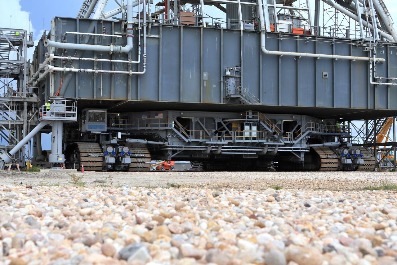 A close-up view of NASA's crawler-transporter 2 (CT-2) with the mobile launcher (ML) atop as it slowly moves along the crawlerway on its trek to Launch Pad 39B on Aug. 30, 2018, at the agency's Kennedy Space Center in Florida. CT-2 will move the ML up to the surface of the pad where it will undergo a fit check, followed by several days of systems testing. The 380-foot-tall mobile launcher is equipped with the crew access arm and several umbilicals that will provide power, environmental control, pneumatics, communication and electrical connections to NASA's Space Launch System (SLS) and Orion spacecraft. Exploration Ground Systems is preparing the ground systems necessary to launch SLS and Orion on Exploration Mission-1, missions to the Moon and on to Mars.
