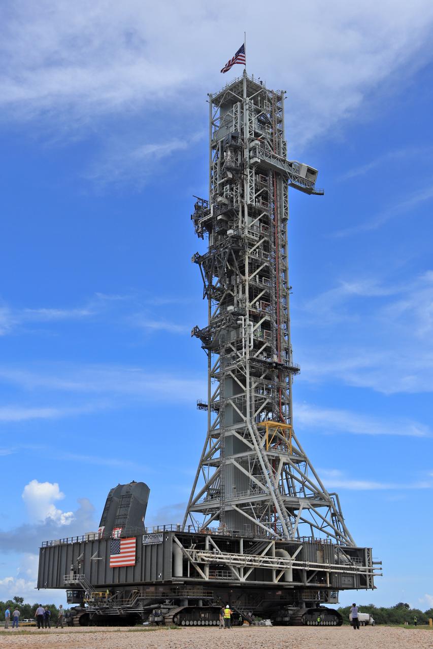 NASA's crawler-transporter 2 (CT-2) with the mobile launcher (ML) atop slowly moves along the crawlerway on its trek to Launch Pad 39B on Aug. 30, 2018, at the agency's Kennedy Space Center in Florida. CT-2 will move the ML up to the surface of the pad where it will undergo a fit check, followed by several days of systems testing. The 380-foot-tall mobile launcher is equipped with the crew access arm and several umbilicals that will provide power, environmental control, pneumatics, communication and electrical connections to NASA's Space Launch System (SLS) and Orion spacecraft. Exploration Ground Systems is preparing the ground systems necessary to launch SLS and Orion on Exploration Mission-1, missions to the Moon and on to Mars.