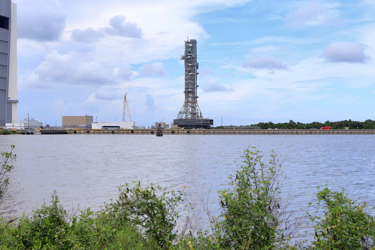 NASA's crawler-transporter 2 (CT-2) with the mobile launcher (ML) atop begins its trek along the crawlerway to Launch Pad 39B on Aug. 30, 2018, at the agency's Kennedy Space Center in Florida. CT-2 will move the ML up to the surface of the pad where it will undergo a fit check, followed by several days of systems testing. The 380-foot-tall mobile launcher is equipped with the crew access arm and several umbilicals that will provide power, environmental control, pneumatics, communication and electrical connections to NASA's Space Launch System (SLS) and Orion spacecraft. Exploration Ground Systems is preparing the ground systems necessary to launch SLS and Orion on Exploration Mission-1, missions to the Moon and on to Mars.