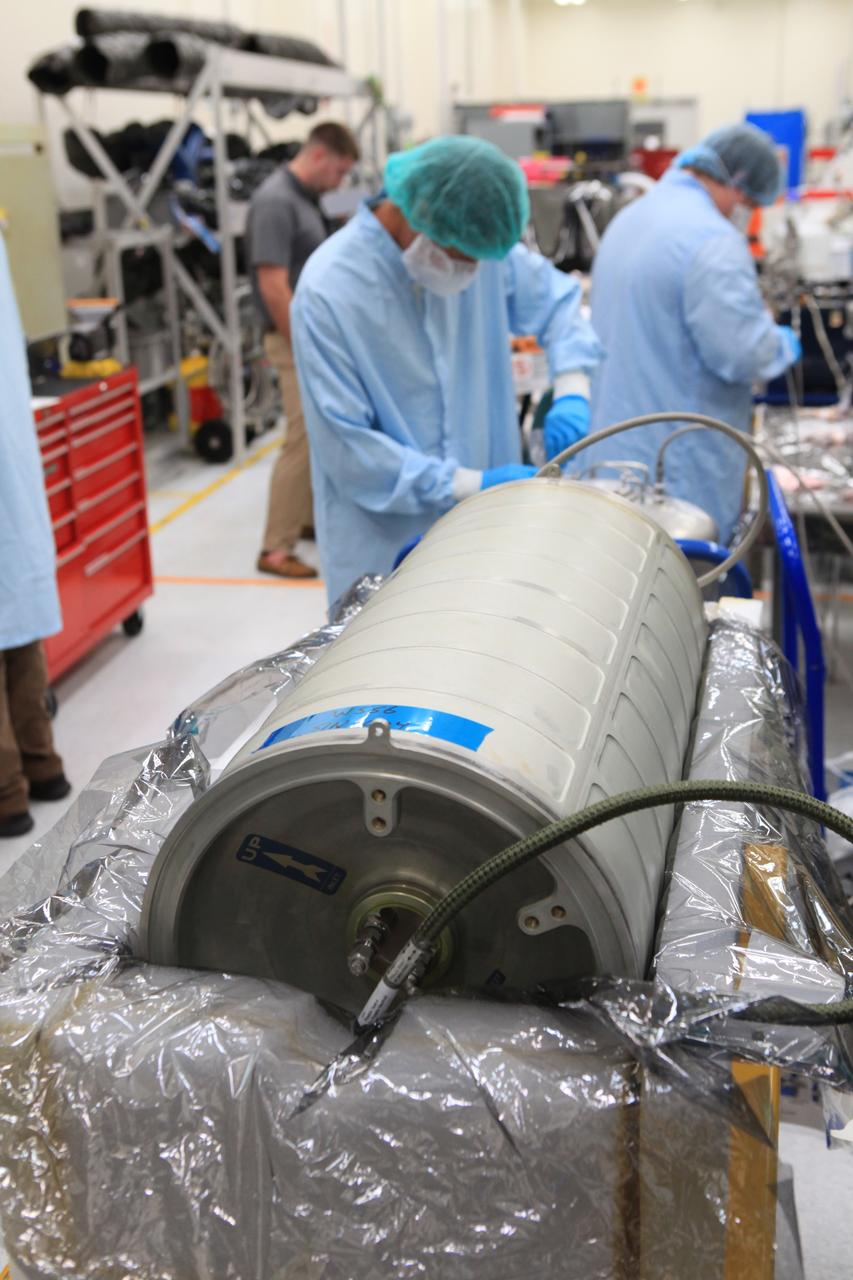 Inside the Space Station Processing Facility high bay at NASA's Kennedy Space Center in Florida, technicians work on the pump package assembly (PPA) on Aug. 30, 2018. The payload will be carried to the International Space Station on SpaceX's 16th Commercial Resupply Services mission. The PPA will be used to continuously drive the cooling water in the space station's thermal control system. The assembly includes a centrifuge pump, a fine filter and gas trap for pump protection, a coarse outlet filter, sensors, and an accumulator. The PPA also will provide a reservoir used for makeup of coolant if leakage occurred. CRS-16 is scheduled to launch to the space station later this year.