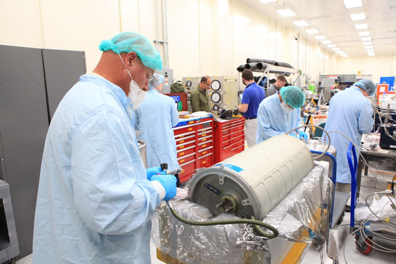 Inside the Space Station Processing Facility high bay at NASA's Kennedy Space Center in Florida, technicians work on the pump package assembly (PPA) on Aug. 30, 2018. The payload will be carried to the International Space Station on SpaceX's 16th Commercial Resupply Services mission. The PPA will be used to continuously drive the cooling water in the space station's thermal control system. The assembly includes a centrifuge pump, a fine filter and gas trap for pump protection, a coarse outlet filter, sensors, and an accumulator. The PPA also will provide a reservoir used for makeup of coolant if leakage occurred. CRS-16 is scheduled to launch to the space station later this year.