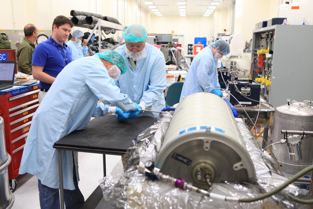 Inside the Space Station Processing Facility high bay at NASA's Kennedy Space Center in Florida, technicians work on the pump package assembly (PPA) on Aug. 30, 2018. The payload will be carried to the International Space Station on SpaceX's 16th Commercial Resupply Services mission. The PPA will be used to continuously drive the cooling water in the space station's thermal control system. The assembly includes a centrifuge pump, a fine filter and gas trap for pump protection, a coarse outlet filter, sensors, and an accumulator. The PPA also will provide a reservoir used for makeup of coolant if leakage occurred. CRS-16 is scheduled to launch to the space station later this year.