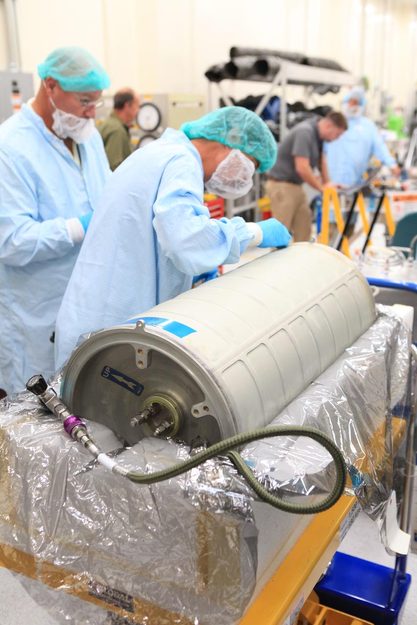 Inside the Space Station Processing Facility high bay at NASA's Kennedy Space Center in Florida, technicians work on the pump package assembly (PPA) on Aug. 30, 2018. The payload will be carried to the International Space Station on SpaceX's 16th Commercial Resupply Services mission. The PPA will be used to continuously drive the cooling water in the space station's thermal control system. The assembly includes a centrifuge pump, a fine filter and gas trap for pump protection, a coarse outlet filter, sensors, and an accumulator. The PPA also will provide a reservoir used for makeup of coolant if leakage occurred. CRS-16 is scheduled to launch to the space station later this year.