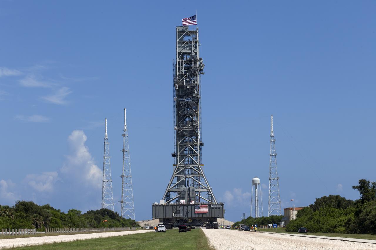 NASA's mobile launcher (ML) atop crawler-transporter 2 arrives at Launch Pad 39B on Aug. 31, 2018, at the agency's Kennedy Space Center in Florida. The ML will undergo a fit check, followed by several days of systems testing. The 380-foot-tall mobile launcher is equipped with the crew access arm and several umbilicals that will provide power, environmental control, pneumatics, communication and electrical connections to NASA's Space Launch System (SLS) and Orion spacecraft. Exploration Ground Systems is preparing the ground systems necessary to launch SLS and Orion on Exploration Mission-1, missions to the Moon and on to Mars.
