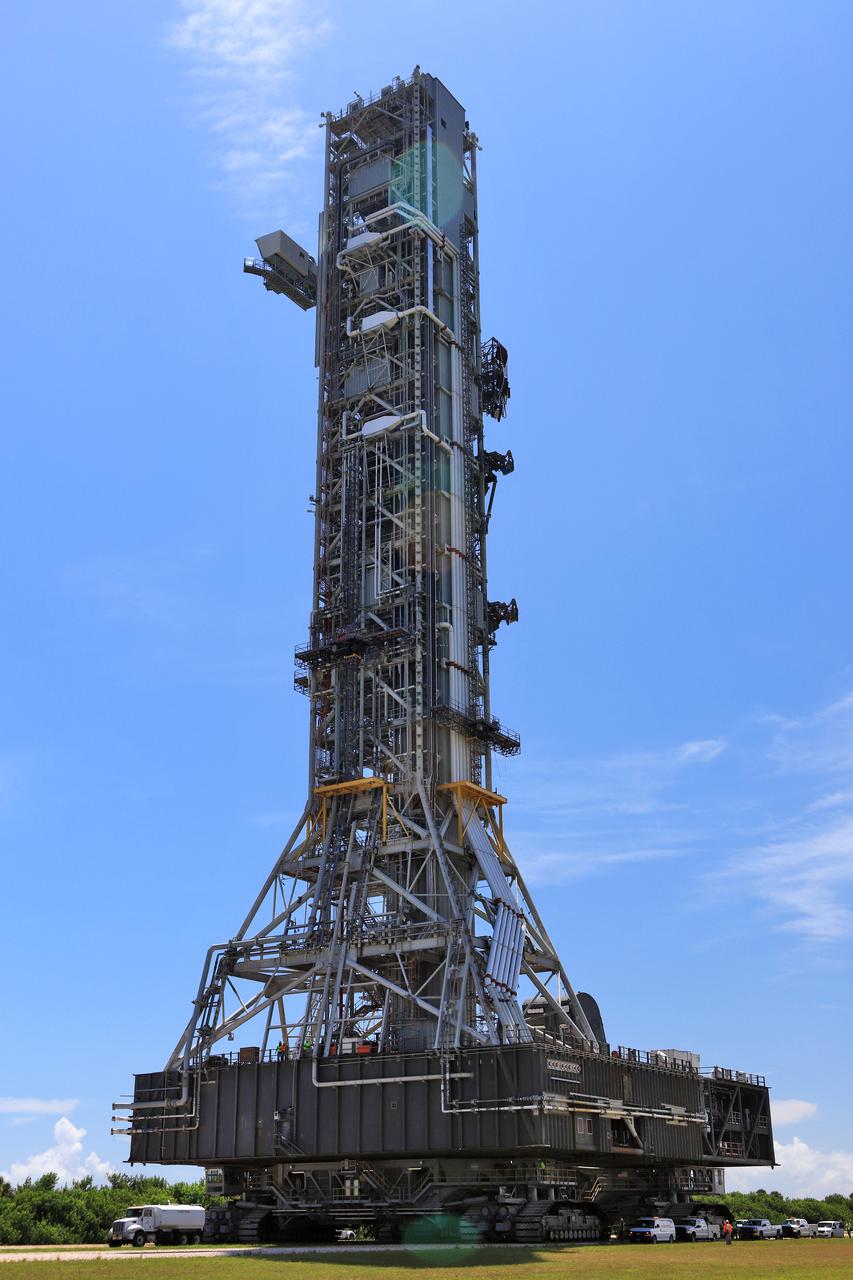 NASA's crawler-transporter 2 (CT-2) with the mobile launcher (ML) atop slowly moves along the crawlerway on its trek to Launch Pad 39B on Aug. 31, 2018, at the agency's Kennedy Space Center in Florida. CT-2 will move the ML up to the surface of the pad where it will undergo a fit check, followed by several days of systems testing. The 380-foot-tall mobile launcher is equipped with the crew access arm and several umbilicals that will provide power, environmental control, pneumatics, communication and electrical connections to NASA's Space Launch System (SLS) and Orion spacecraft. Exploration Ground Systems is preparing the ground systems necessary to launch SLS and Orion on Exploration Mission-1, missions to the Moon and on to Mars.