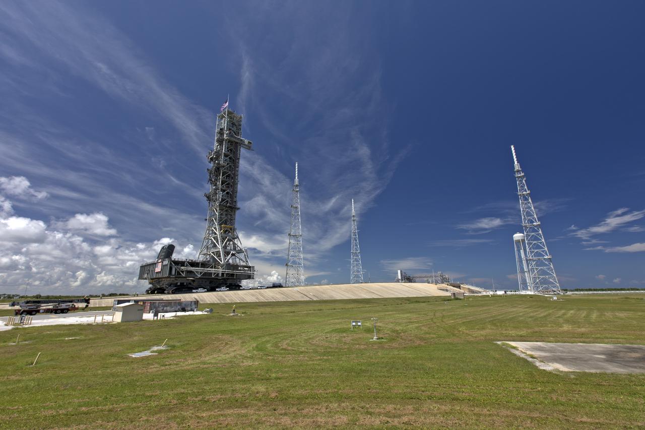 The crawler-transporter 2, with NASA's mobile launcher atop, makes its way up the ramp to the top of Launch Pad 39B at NASA's Kennedy Space Center in Florida, on Aug. 31, 2018. The ML will undergo a fit check, followed by several days of systems testing. The 380-foot-tall mobile launcher is equipped with the crew access arm and several umbilicals that will provide power, environmental control, pneumatics, communication and electrical connections to NASA's Space Launch System (SLS) and Orion spacecraft. Exploration Ground Systems is preparing the ground systems necessary to launch SLS and Orion on Exploration Mission-1, missions to the Moon and on to Mars.