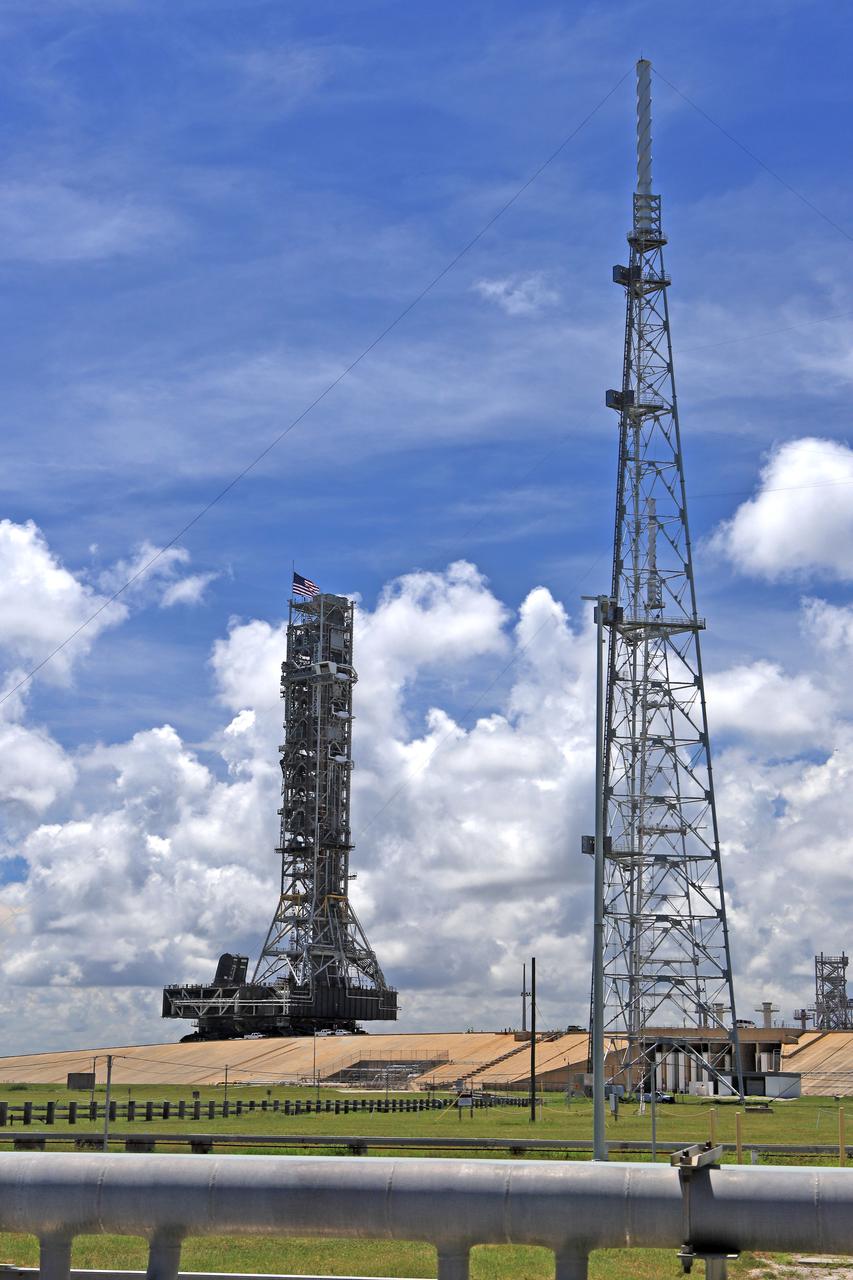 The crawler-transporter 2, with NASA's mobile launcher atop, makes its way up the ramp to the top of Launch Pad 39B at NASA's Kennedy Space Center in Florida, on Aug. 31, 2018. The ML will undergo a fit check, followed by several days of systems testing. The 380-foot-tall mobile launcher is equipped with the crew access arm and several umbilicals that will provide power, environmental control, pneumatics, communication and electrical connections to NASA's Space Launch System (SLS) and Orion spacecraft. Exploration Ground Systems is preparing the ground systems necessary to launch SLS and Orion on Exploration Mission-1, missions to the Moon and on to Mars.