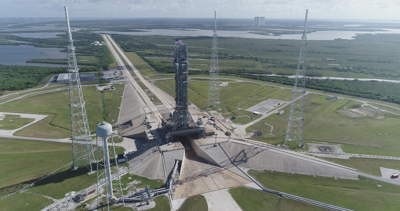 NASA's mobile launcher (ML) atop crawler-transporter 2 is at the top of Launch Pad 39B on Aug. 31, 2018, at the agency's Kennedy Space Center in Florida. The ML will undergo a fit check, followed by several days of systems testing. The 380-foot-tall mobile launcher is equipped with the crew access arm and several umbilicals that will provide power, environmental control, pneumatics, communication and electrical connections to NASA's Space Launch System (SLS) and Orion spacecraft. Exploration Ground Systems is preparing the ground systems necessary to launch SLS and Orion on Exploration Mission-1, missions to the Moon and on to Mars. Photo credit: NASA/Jamie Peer <b><a href="http://www.nasa.gov/audience/formedia/features/MP_Photo_Guidelines.html" rel="nofollow">NASA image use policy.</a></b>