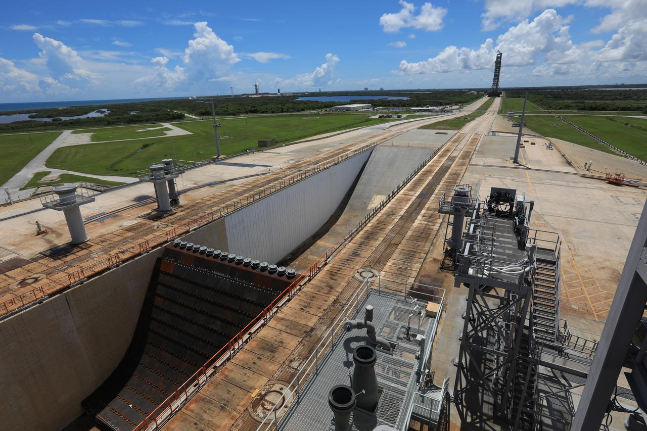 NASA's mobile launcher atop crawler-transporter 2 begins its trek off of Launch Pad 39B on Sept. 7, 2018, at NASA's Kennedy Space Center in Florida. After undergoing a fit check and several days of systems testing with the pad, the mobile launcher is on its way to the Vehicle Assembly Building. This is the first time that the modified mobile launcher made the trip to the pad. The 380-foot-tall mobile launcher is equipped with the crew access arm and several umbilicals that will provide power, environmental control. Pneumatics, communication and electrical connections to the agency's Space Launch System and Orion spacecraft. Exploration Ground Systems is preparing the ground systems necessary to launch SLS and Orion on Exploration Mission-1, missions to the Moon and on to Mars.