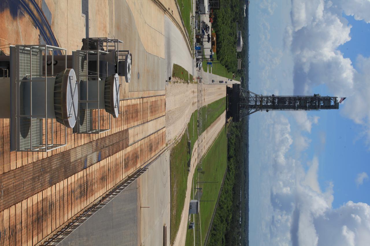NASA's mobile launcher atop crawler-transporter 2 begins its trek off of Launch Pad 39B on Sept. 7, 2018, at NASA's Kennedy Space Center in Florida. After undergoing a fit check and several days of systems testing with the pad, the mobile launcher is on its way to the Vehicle Assembly Building. This is the first time that the modified mobile launcher made the trip to the pad. The 380-foot-tall mobile launcher is equipped with the crew access arm and several umbilicals that will provide power, environmental control. Pneumatics, communication and electrical connections to the agency's Space Launch System and Orion spacecraft. Exploration Ground Systems is preparing the ground systems necessary to launch SLS and Orion on Exploration Mission-1, missions to the Moon and on to Mars.