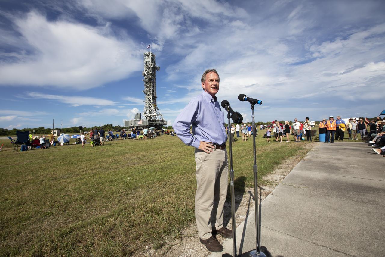 Mike Bolger, program manager of Exploration Ground Systems, speaks to workers and guests during an employee event for the mobile launcher move to the Vehicle Assembly Building (VAB) on Sept. 7, 2018, at NASA's Kennedy Space Center in Florida. The mobile launcher, atop crawler-transporter 2, began its trek from Launch Pad 39B along the crawlerway after undergoing a fit check and several days of systems testing with the pad. This is the first time that the modified mobile launcher made the trip to the pad. The 380-foot-tall mobile launcher is equipped with the crew access arm and several umbilicals that will provide power, environmental control, pneumatics, communication and electrical connections to the agency's Space Launch System and Orion spacecraft. The mobile launcher will spend seven months in the VAB undergoing testing. Exploration Ground Systems is preparing the ground systems necessary to launch SLS and Orion on Exploration Mission-1, missions to the Moon and on to Mars.