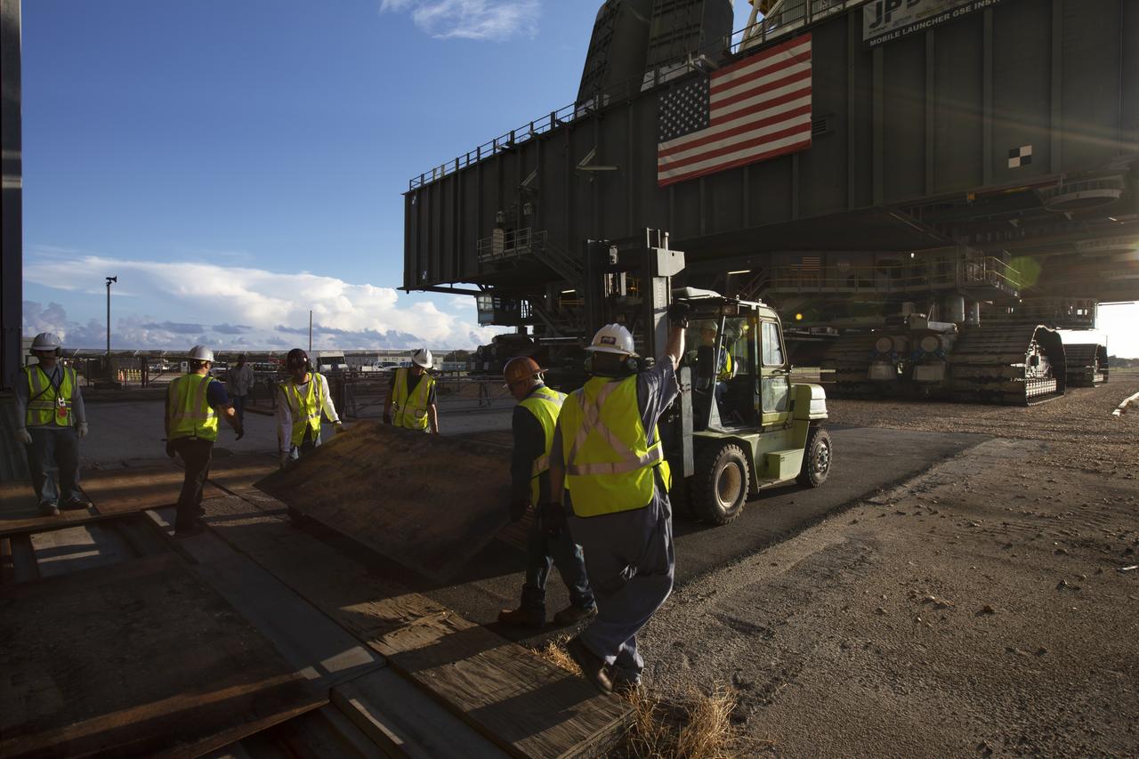 Preparations are underway to move NASA's mobile launcher, atop crawler-transporter 2, into High Bay 3 at the Vehicle Assembly Building (VAB) on Sept. 8, 2018, at NASA's Kennedy Space Center in Florida. The mobile launcher departed Launch Pad 39B after several days of testing with the pad. This is the first time that the modified mobile launcher made the trip to the pad and the VAB. The mobile launcher will spend seven months in the VAB undergoing testing. The 380-foot-tall structure is equipped with the crew access arm and several umbilicals that will provide power, environmental control, pneumatics, communication and electrical connections to the agency's Space Launch System and Orion spacecraft. Exploration Ground Systems is preparing the ground systems necessary to launch SLS and Orion on Exploration Mission-1, missions to the Moon and on to Mars.