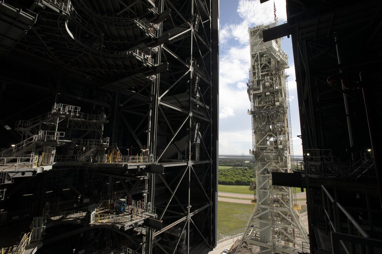 NASA's mobile launcher, atop crawler-transporter 2, begins the move into High Bay 3 at the Vehicle Assembly Building (VAB) on Sept. 8, 2018, at NASA's Kennedy Space Center in Florida. The mobile launcher departed Launch Pad 39B after several days of testing with the pad. This is the first time that the modified mobile launcher made the trip to the pad and the VAB. The mobile launcher will spend seven months in the VAB undergoing testing. The 380-foot-tall structure is equipped with the crew access arm and several umbilicals that will provide power, environmental control, pneumatics, communication and electrical connections to the agency's Space Launch System and Orion spacecraft. Exploration Ground Systems is preparing the ground systems necessary to launch SLS and Orion on Exploration Mission-1, missions to the Moon and on to Mars.