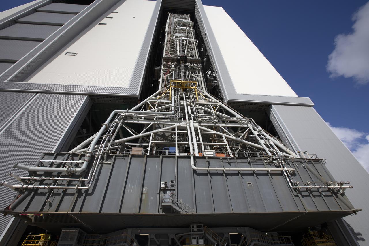 NASA's mobile launcher, atop crawler-transporter 2, moves into High Bay 3 at the Vehicle Assembly Building (VAB) on Sept. 8, 2018, at NASA's Kennedy Space Center in Florida. The mobile launcher departed Launch Pad 39B after several days of testing with the pad. This is the first time that the modified mobile launcher made the trip to the pad and the VAB. The mobile launcher will spend seven months in the VAB undergoing testing. The 380-foot-tall structure is equipped with the crew access arm and several umbilicals that will provide power, environmental control, pneumatics, communication and electrical connections to the agency's Space Launch System and Orion spacecraft. Exploration Ground Systems is preparing the ground systems necessary to launch SLS and Orion on Exploration Mission-1, missions to the Moon and on to Mars.