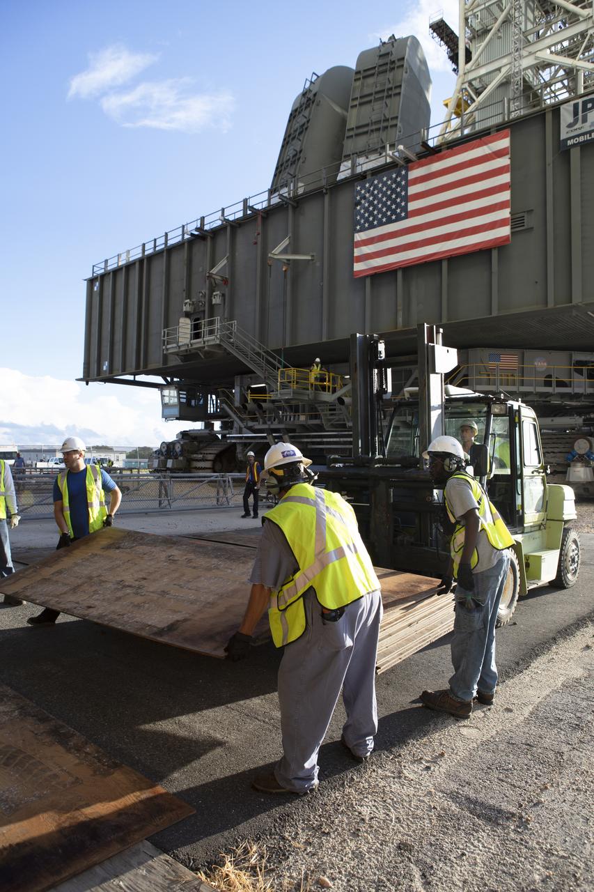 Preparations are underway to move NASA's mobile launcher, atop crawler-transporter 2, into High Bay 3 at the Vehicle Assembly Building (VAB) on Sept. 8, 2018, at NASA's Kennedy Space Center in Florida. The mobile launcher departed Launch Pad 39B after several days of testing with the pad. This is the first time that the modified mobile launcher made the trip to the pad and the VAB. The mobile launcher will spend seven months in the VAB undergoing testing. The 380-foot-tall structure is equipped with the crew access arm and several umbilicals that will provide power, environmental control, pneumatics, communication and electrical connections to the agency's Space Launch System and Orion spacecraft. Exploration Ground Systems is preparing the ground systems necessary to launch SLS and Orion on Exploration Mission-1, missions to the Moon and on to Mars.