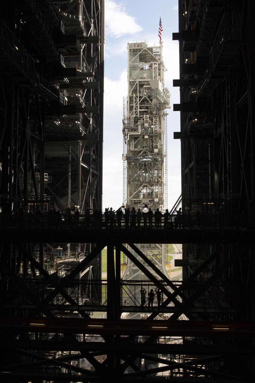 NASA's mobile launcher, atop crawler-transporter 2, moves slowly into High Bay 3 at the Vehicle Assembly Building (VAB) on Sept. 8, 2018, at NASA's Kennedy Space Center in Florida. The mobile launcher departed Launch Pad 39B after several days of testing with the pad. This is the first time that the modified mobile launcher made the trip to the pad and the VAB. The mobile launcher will spend seven months in the VAB undergoing testing. The 380-foot-tall structure is equipped with the crew access arm and several umbilicals that will provide power, environmental control, pneumatics, communication and electrical connections to the agency's Space Launch System and Orion spacecraft. Exploration Ground Systems is preparing the ground systems necessary to launch SLS and Orion on Exploration Mission-1, missions to the Moon and on to Mars.