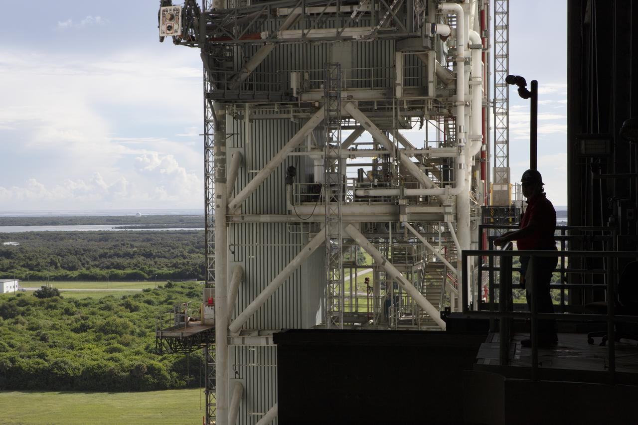 NASA's mobile launcher, atop crawler-transporter 2, moves slowly into High Bay 3 at the Vehicle Assembly Building (VAB) on Sept. 8, 2018, at NASA's Kennedy Space Center in Florida. The mobile launcher departed Launch Pad 39B after several days of testing with the pad. This is the first time that the modified mobile launcher made the trip to the pad and the VAB. The mobile launcher will spend seven months in the VAB undergoing testing. The 380-foot-tall structure is equipped with the crew access arm and several umbilicals that will provide power, environmental control, pneumatics, communication and electrical connections to the agency's Space Launch System and Orion spacecraft. Exploration Ground Systems is preparing the ground systems necessary to launch SLS and Orion on Exploration Mission-1, missions to the Moon and on to Mars.