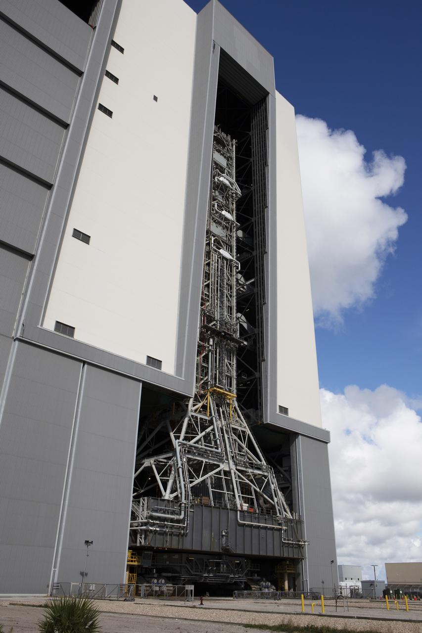 NASA's mobile launcher, atop crawler-transporter 2, moves slowly into High Bay 3 at the Vehicle Assembly Building (VAB) on Sept. 8, 2018, at NASA's Kennedy Space Center in Florida. The mobile launcher departed Launch Pad 39B after several days of testing with the pad. This is the first time that the modified mobile launcher made the trip to the pad and the VAB. The mobile launcher will spend seven months in the VAB undergoing testing. The 380-foot-tall structure is equipped with the crew access arm and several umbilicals that will provide power, environmental control, pneumatics, communication and electrical connections to the agency's Space Launch System and Orion spacecraft. Exploration Ground Systems is preparing the ground systems necessary to launch SLS and Orion on Exploration Mission-1, missions to the Moon and on to Mars.