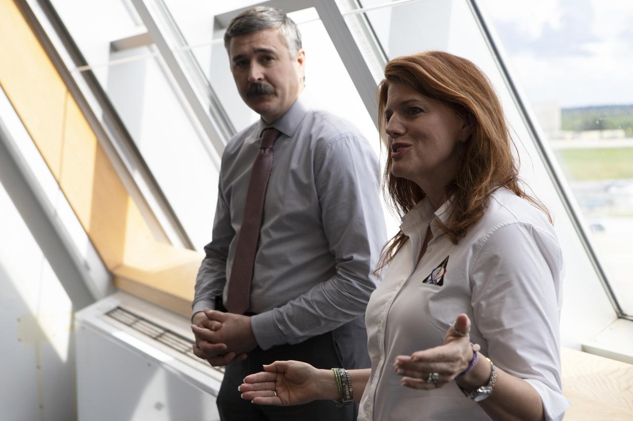 Charlie Blackwell-Thompson, Exploration Mission-1 launch director, and Michael Sarafin, EM-1 mission manager, talk to members of the media inside the Launch Control Center at NASA's Kennedy Space Center in Florida, on Sept. 8, 2018. Exploration Ground Systems is preparing the ground systems necessary to launch the agency's Space Launch System and Orion on EM-1, missions to the Moon and on to Mars.