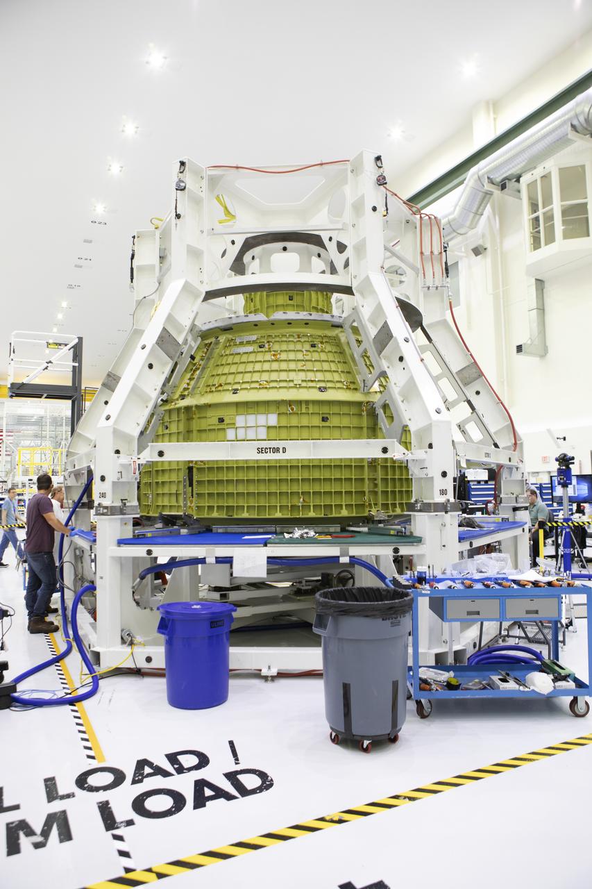 The Orion pressure vessel for Exploration Mission-2 (EM-2) is inside processing equipment where it is getting where it is getting initial processing done.