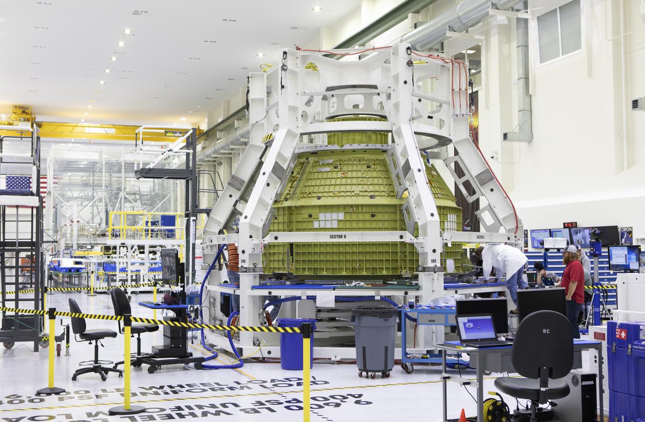 The Orion pressure vessel for Exploration Mission-2 (EM-2) is inside processing equipment where it is getting where it is getting initial processing done.