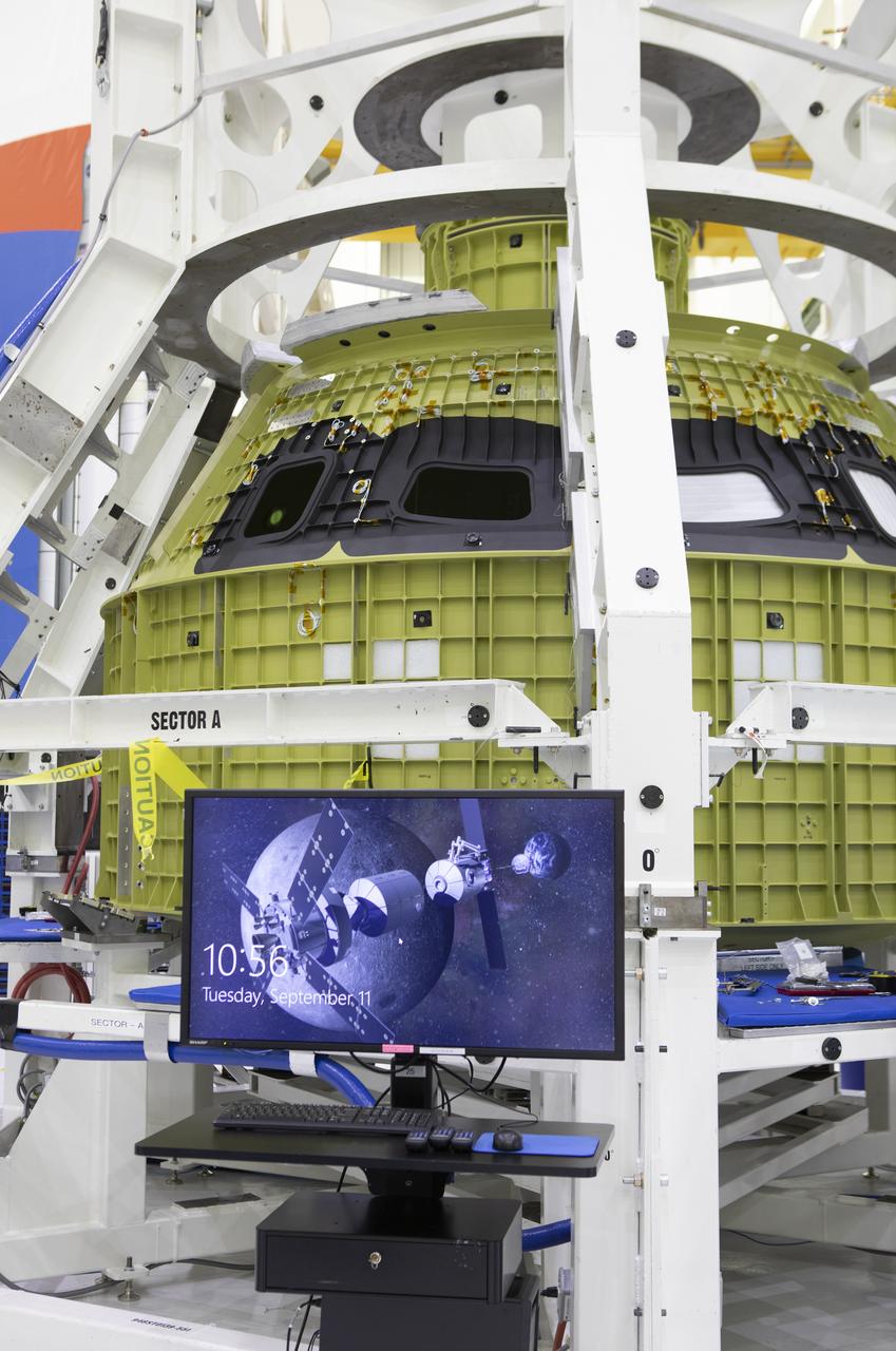 The Orion pressure vessel for Exploration Mission-2 (EM-2) is inside processing equipment where it is getting where it is getting initial processing done.