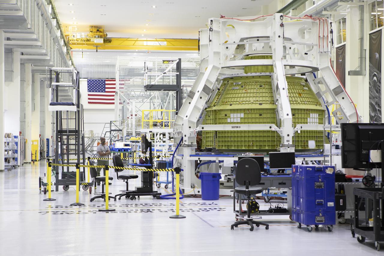 The Orion pressure vessel for Exploration Mission-2 (EM-2) is inside processing equipment where it is getting where it is getting initial processing done.