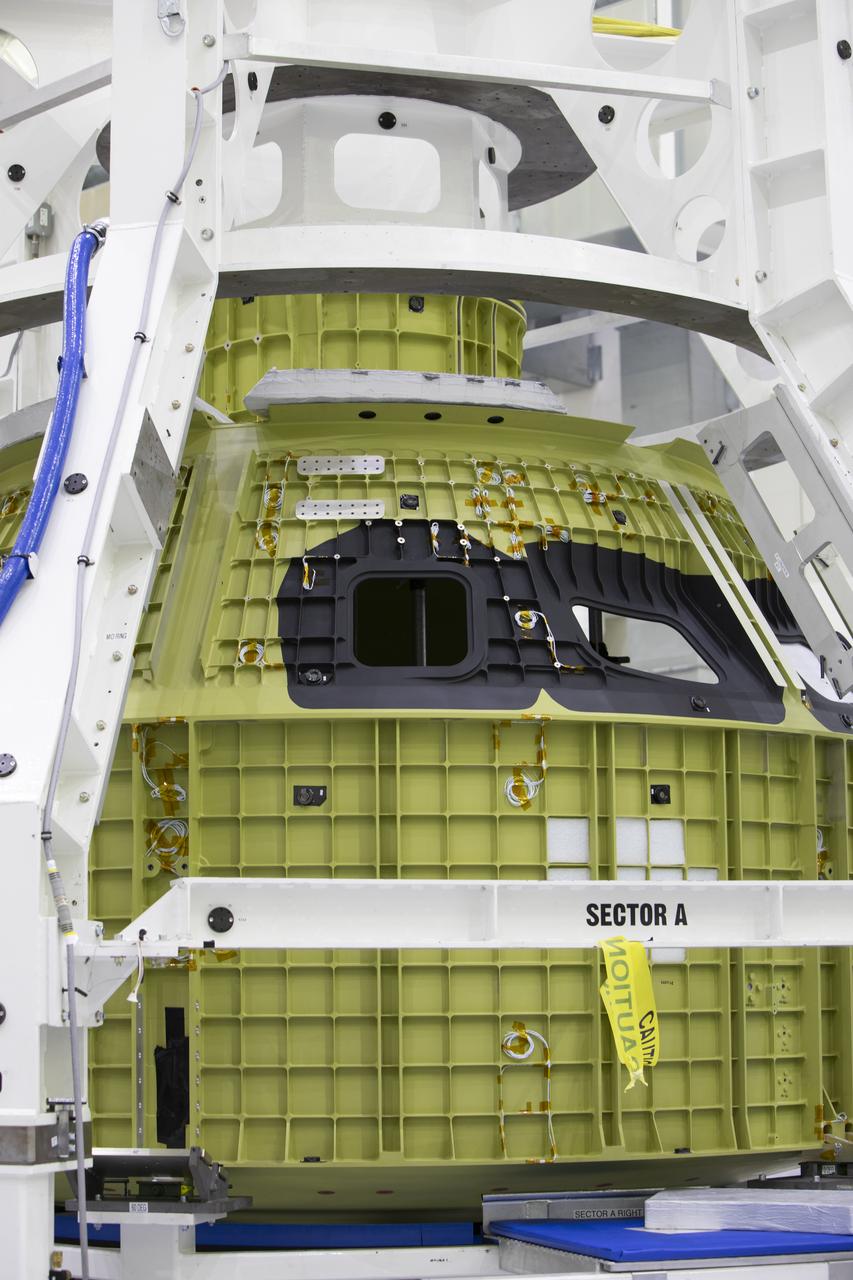 The Orion pressure vessel for Exploration Mission-2 (EM-2) is inside processing equipment where it is getting where it is getting initial processing done.