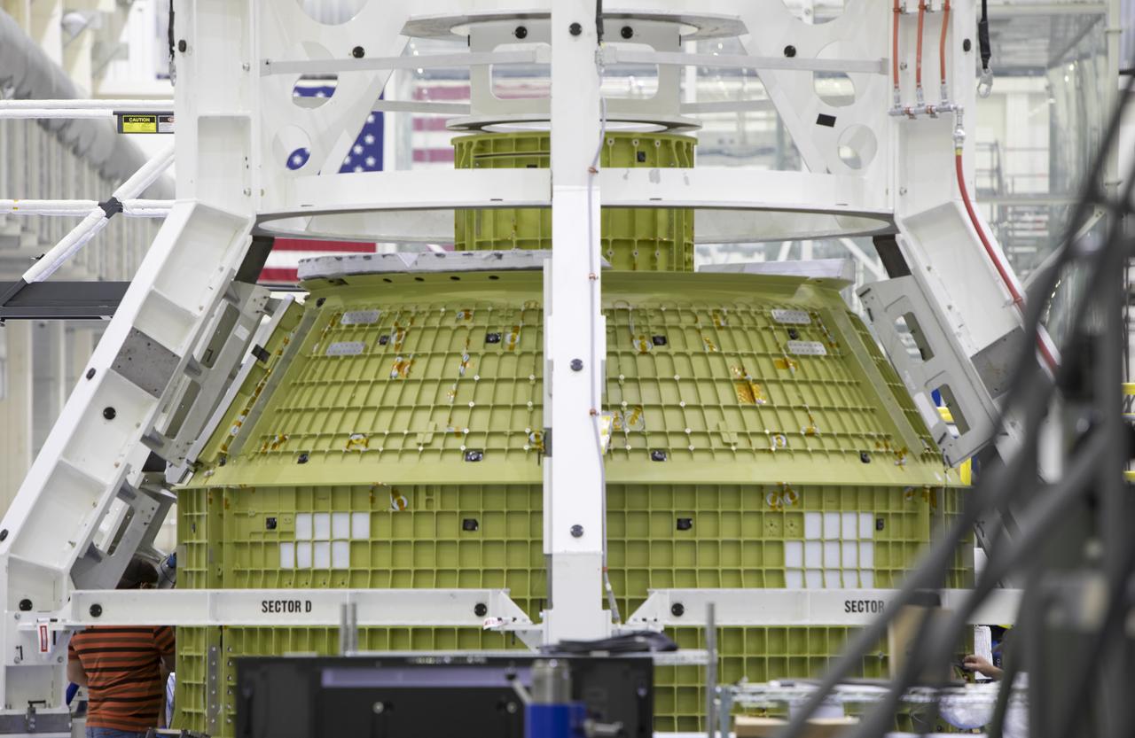 The Orion pressure vessel for Exploration Mission-2 (EM-2) is inside processing equipment where it is getting where it is getting initial processing done.