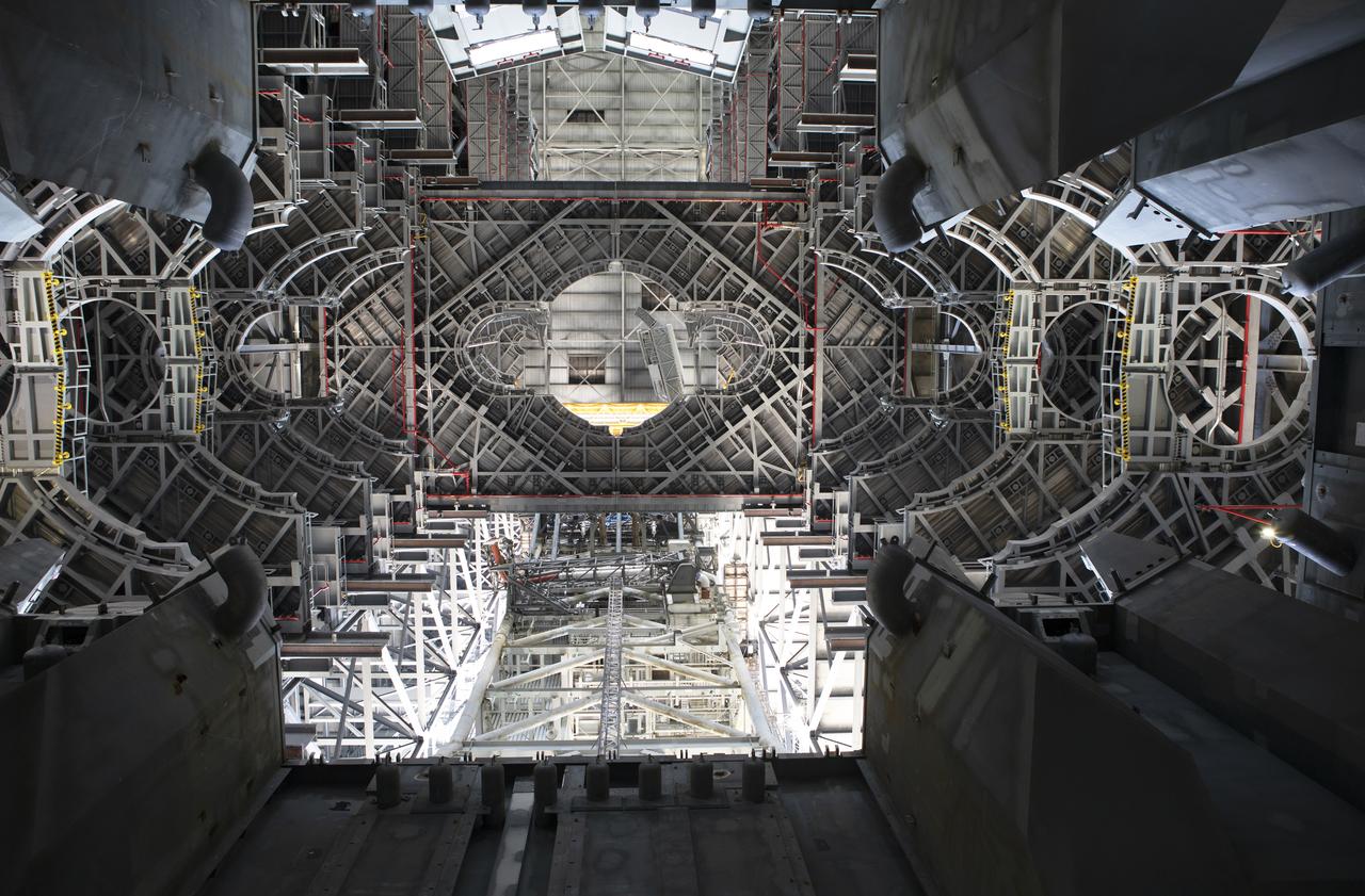 NASA's mobile launcher is inside High Bay 3 at the Vehicle Assembly Building (VAB) on Sept. 11, 2018, at NASA's Kennedy Space Center in Florida. In view are several levels of the new work platforms. One level has been extended around the mobile launcher tower, and the crew access arm, in view at the top, is being extended. The mobile launcher will spend seven months in the VAB undergoing testing. The 380-foot-tall structure is equipped with the crew access arm and several umbilicals that will provide power, environmental control, pneumatics, communication and electrical connections to the agency's Space Launch System and Orion spacecraft. Exploration Ground Systems is preparing the ground systems necessary to launch SLS and Orion on Exploration Mission-1, missions to the Moon and on to Mars.