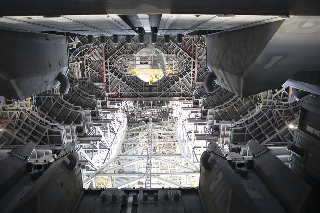 NASA's mobile launcher is inside High Bay 3 at the Vehicle Assembly Building (VAB) on Sept. 11, 2018, at NASA's Kennedy Space Center in Florida. In view are several levels of the new work platforms. One platform level has been extended around the mobile launcher tower, and the crew access arm, in view at the top, is being extended. The mobile launcher will spend seven months in the VAB undergoing testing. The 380-foot-tall structure is equipped with the crew access arm and several umbilicals that will provide power, environmental control, pneumatics, communication and electrical connections to the agency's Space Launch System and Orion spacecraft. Exploration Ground Systems is preparing the ground systems necessary to launch SLS and Orion on Exploration Mission-1, missions to the Moon and on to Mars.