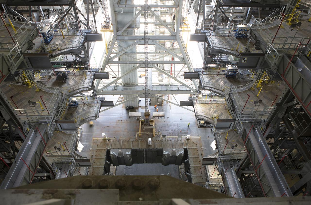 In this view looking down from high above on the mobile launcher in High Bay 3 of the Vehicle Assembly Building at NASA's Kennedy Space Center in Florida, on Sept. 11, 2018, the mobile launcher is in the high bay to begin several months of testing. Several of the new work platforms that will surround the mobile launcher during stacking and processing operations are in view. The 380-foot-tall structure is equipped with the crew access arm and several umbilicals that will provide power, environmental control, pneumatics, communication and electrical connections to the agency's Space Launch System and Orion spacecraft. Exploration Ground Systems is preparing the ground systems necessary to launch SLS and Orion on Exploration Mission-1, missions to the Moon and on to Mars.