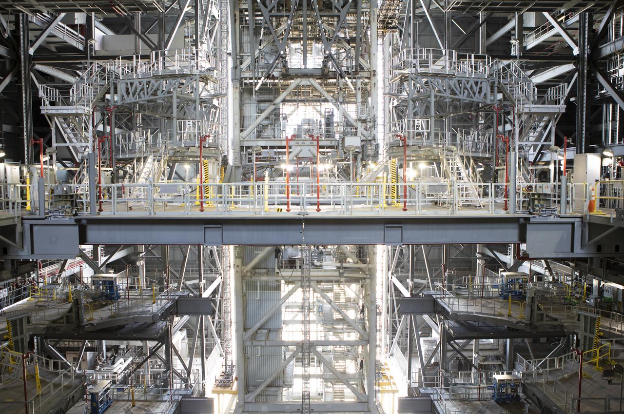NASA's mobile launcher is in view inside High Bay 3 of the Vehicle Assembly Building at the agency's Kennedy Space Center in Florida, on Sept. 11, 2018. Several of the new work platforms that will surround the mobile launcher during stacking and processing operations are in view. The mobile launcher will spend seven months in the VAB undergoing testing. The 380-foot-tall structure is equipped with the crew access arm and several umbilicals that will provide power, environmental control, pneumatics, communication and electrical connections to the agency's Space Launch System and Orion spacecraft. Exploration Ground Systems is preparing the ground systems necessary to launch SLS and Orion on Exploration Mission-1, missions to the Moon and on to Mars.