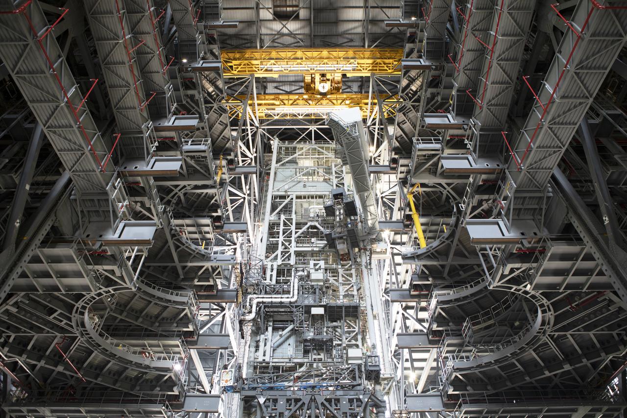 NASA's mobile launcher is secured inside High Bay 3 at the Vehicle Assembly Building (VAB) on Sept. 11, 2018, at NASA's Kennedy Space Center in Florida. In view are several levels of the new work platforms. The crew access arm, at the top, is being extended. The mobile launcher will spend seven months in the VAB undergoing testing. The 380-foot-tall structure is equipped with the crew access arm and several umbilicals that will provide power, environmental control, pneumatics, communication and electrical connections to the agency's Space Launch System and Orion spacecraft. Exploration Ground Systems is preparing the ground systems necessary to launch SLS and Orion on Exploration Mission-1, missions to the Moon and on to Mars.