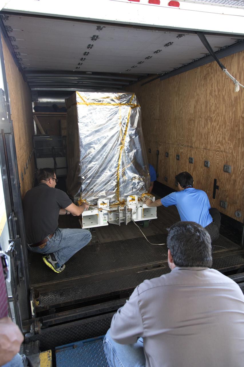 Workers load the Robotic Refueling Mission-3 (RRM3) payload onto a truck at the Space Station Processing Facility for transfer to the Payload Hazardous Servicing Facility on Oct. 3, 2018, at NASA's Kennedy Space Center in Florida. The payload will be carried to the International Space Station on SpaceX's 16th Commercial Resupply Services mission. RRM3 demonstrates the transfer of xenon gas and liquid methane in microgravity, and advances technologies for storing and manipulating these cryogenic fuels robotically. RRM3 also supports development of technology for the Restore-L mission, a robotic spacecraft equipped to service satellites in-orbit.