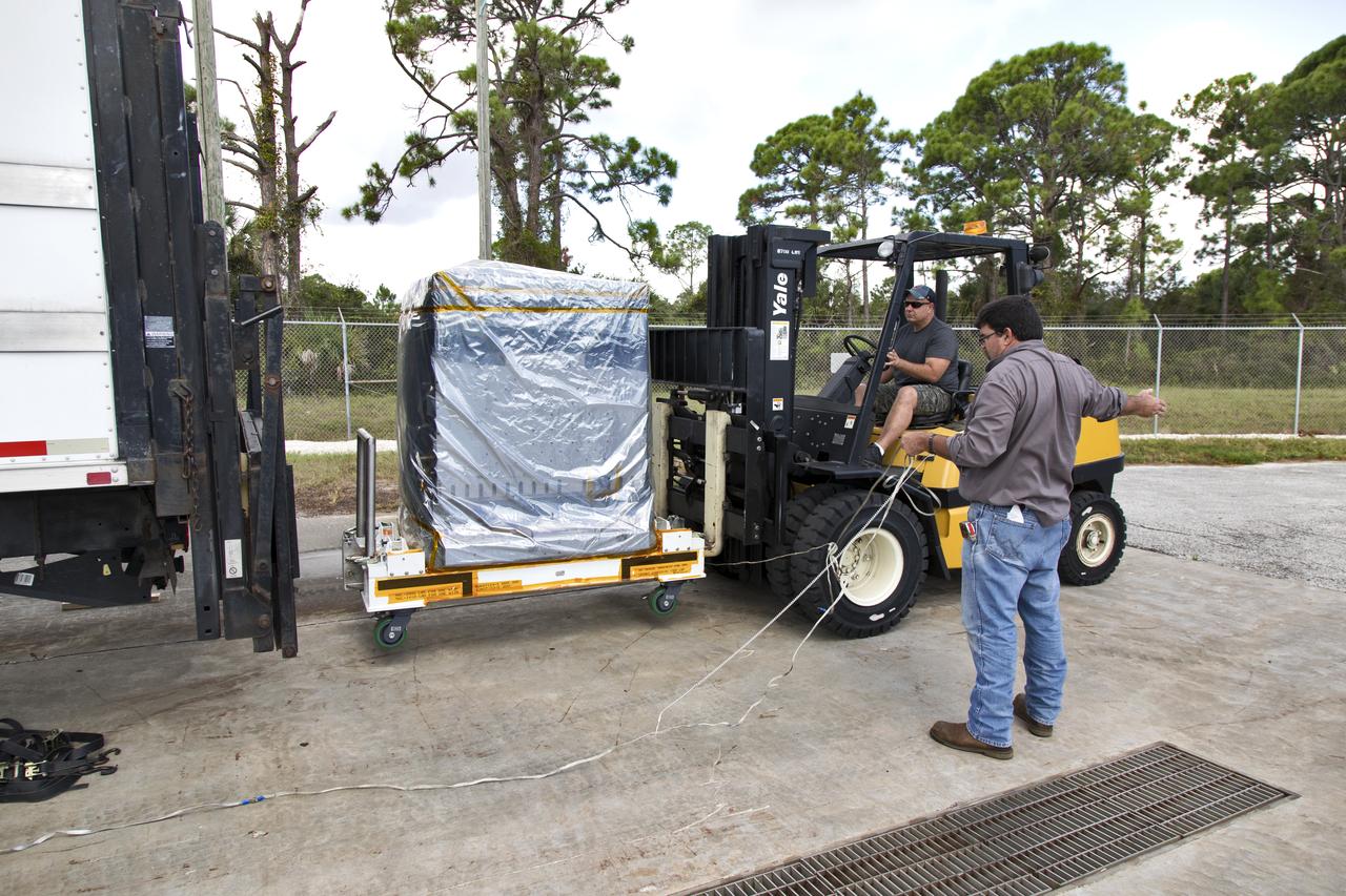A worker uses a forklift to unload the Robotic Refueling Mission-3 (RRM3) payload from a truck at the Payload Hazardous Servicing Facility on Oct. 3, 2018, at NASA's Kennedy Space Center in Florida. The payload will be carried to the International Space Station on SpaceX's 16th Commercial Resupply Services mission. RRM3 demonstrates the transfer of xenon gas and liquid methane in microgravity, and advances technologies for storing and manipulating these cryogenic fuels robotically. RRM3 also supports development of technology for the Restore-L mission, a robotic spacecraft equipped to service satellites in-orbit.