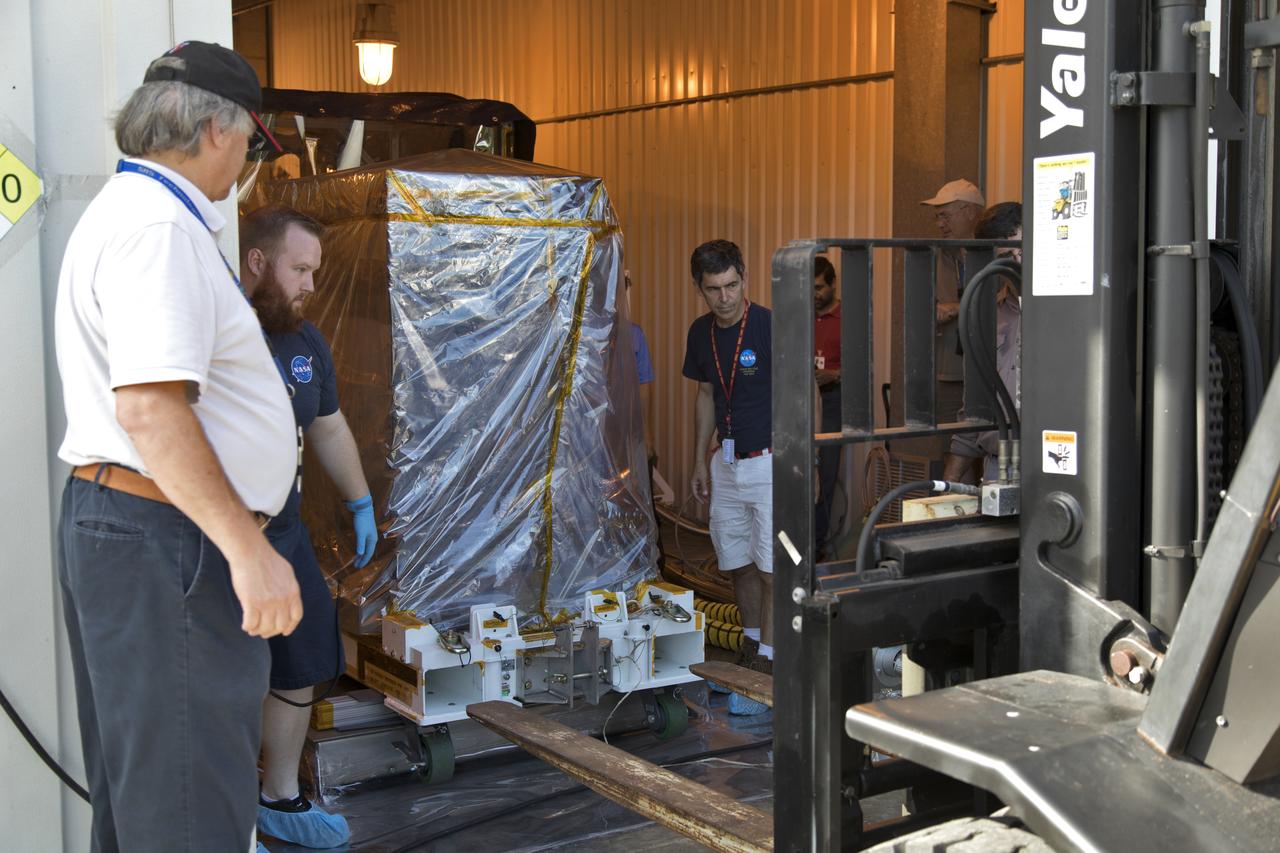 The Robotic Refueling Mission-3 (RRM3) payload is unloaded from a forklift inside the Payload Hazardous Servicing Facility on Oct. 3, 2018, at NASA's Kennedy Space Center in Florida. The payload will be carried to the International Space Station on SpaceX's 16th Commercial Resupply Services mission. RRM3 demonstrates the transfer of xenon gas and liquid methane in microgravity, and advances technologies for storing and manipulating these cryogenic fuels robotically. RRM3 also supports development of technology for the Restore-L mission, a robotic spacecraft equipped to service satellites in-orbit.