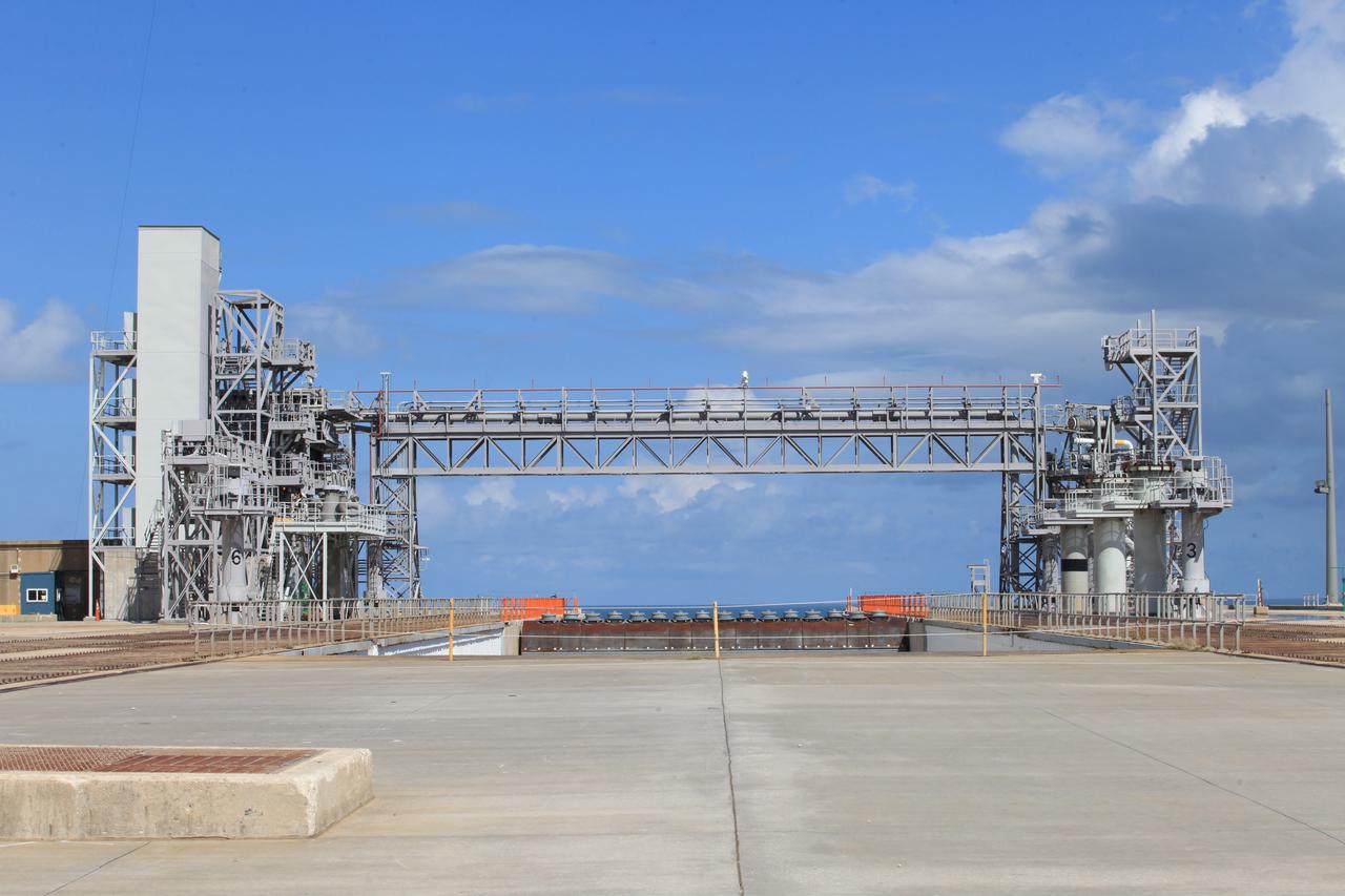 A flow test of the Ignition Overpressure Protection and Sound Suppression water deluge system begins at Launch Pad 39B at NASA's Kennedy Space Center in Florida, on Oct. 15, 2018. At peak flow, the water will reach about 100 feet in the air above the pad surface. The testing is part of Exploration Ground System's preparation for the new Space Launch System rocket. Modifications were made to the pad after a previous wet flow test, increasing the performance of the system. During the launch of Exploration Mission-1 and subsequent missions, this water deluge system will release about 450,000 gallons of water across the mobile launcher and Flame Deflector to reduce the extreme heat and energy generated by the rocket during ignition and liftoff.