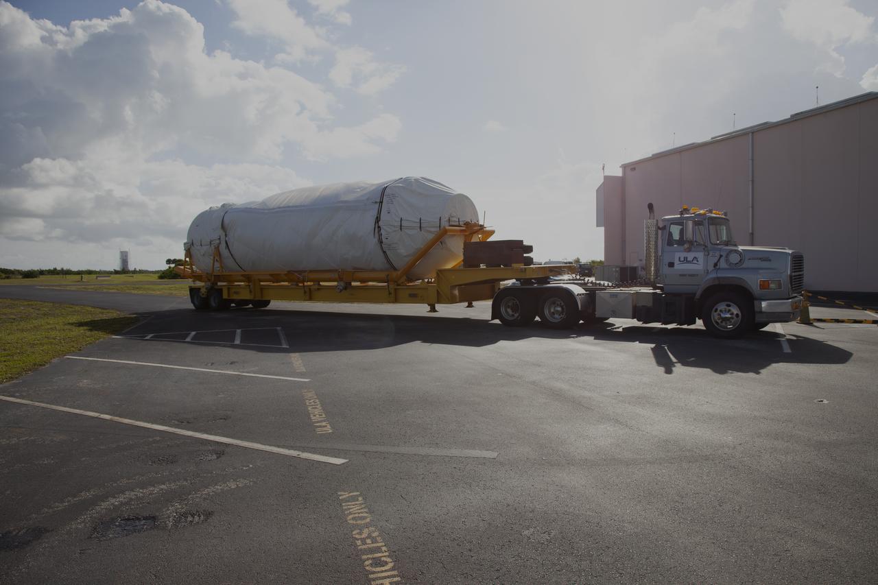 A transport truck with a United Launch Alliance (ULA) two-engine Centaur upper stage arrives at the Atlas Spaceflight Operations Center at Cape Canaveral Air Force Station for preliminary checkouts. Mounted atop a ULA Atlas V rocket, the Centaur will help launch a Boeing CST-100 Starliner spacecraft on an uncrewed Orbital Flight Test from Space Launch Complex 41 at the Cape. NASA’s Commercial Crew Program will return human spaceflight launches to U.S. soil, providing safe, reliable and cost-effective access to low-Earth orbit on systems that meet our safety and mission requirements.