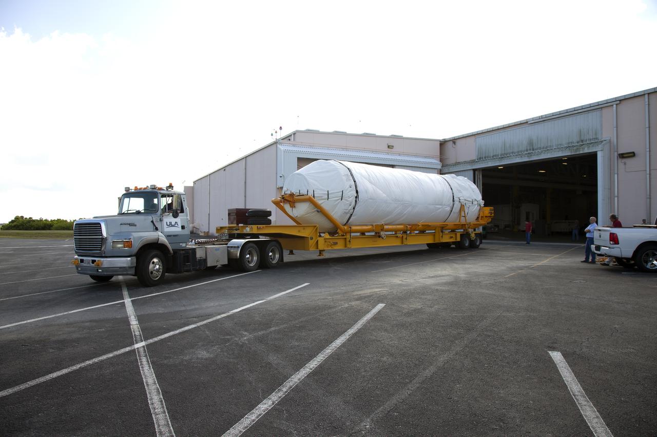 A transport truck with a United Launch Alliance (ULA) two-engine Centaur upper stage arrives at the Atlas Spaceflight Operations Center at Cape Canaveral Air Force Station for preliminary checkouts. Mounted atop a ULA Atlas V rocket, the Centaur will help launch a Boeing CST-100 Starliner spacecraft on an uncrewed Orbital Flight Test from Space Launch Complex 41 at the Cape. NASA’s Commercial Crew Program will return human spaceflight launches to U.S. soil, providing safe, reliable and cost-effective access to low-Earth orbit on systems that meet our safety and mission requirements.