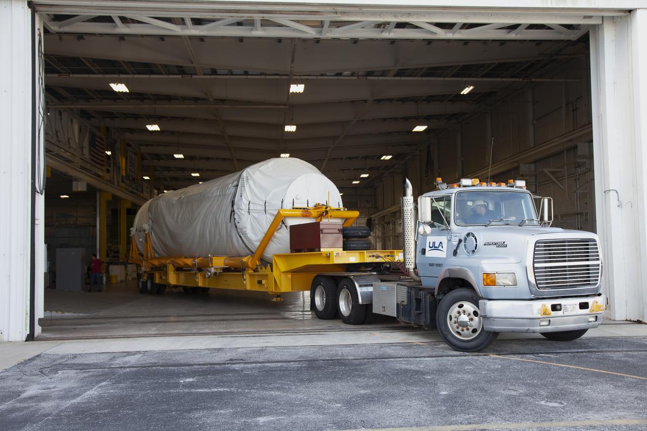 A transport truck with a United Launch Alliance (ULA) two-engine Centaur upper stage arrives at the Atlas Spaceflight Operations Center at Cape Canaveral Air Force Station for preliminary checkouts. Mounted atop a ULA Atlas V rocket, the Centaur will help launch a Boeing CST-100 Starliner spacecraft on an uncrewed Orbital Flight Test from Space Launch Complex 41 at the Cape. NASA’s Commercial Crew Program will return human spaceflight launches to U.S. soil, providing safe, reliable and cost-effective access to low-Earth orbit on systems that meet our safety and mission requirements.