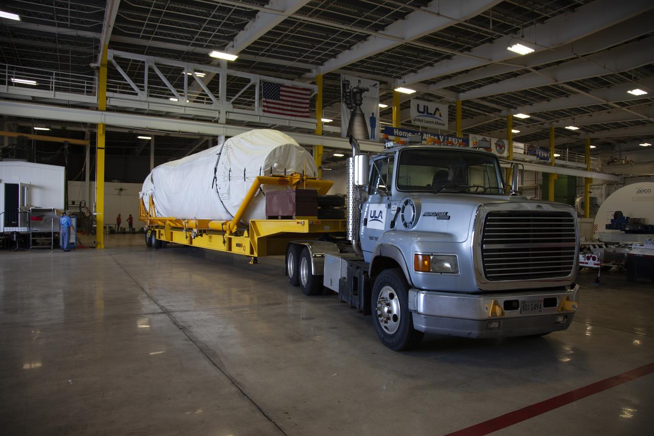 A transport truck with a United Launch Alliance (ULA) two-engine Centaur upper stage arrives at the Atlas Spaceflight Operations Center at Cape Canaveral Air Force Station for preliminary checkouts. Mounted atop a ULA Atlas V rocket, the Centaur will help launch a Boeing CST-100 Starliner spacecraft on an uncrewed Orbital Flight Test from Space Launch Complex 41 at the Cape. NASA’s Commercial Crew Program will return human spaceflight launches to U.S. soil, providing safe, reliable and cost-effective access to low-Earth orbit on systems that meet our safety and mission requirements.