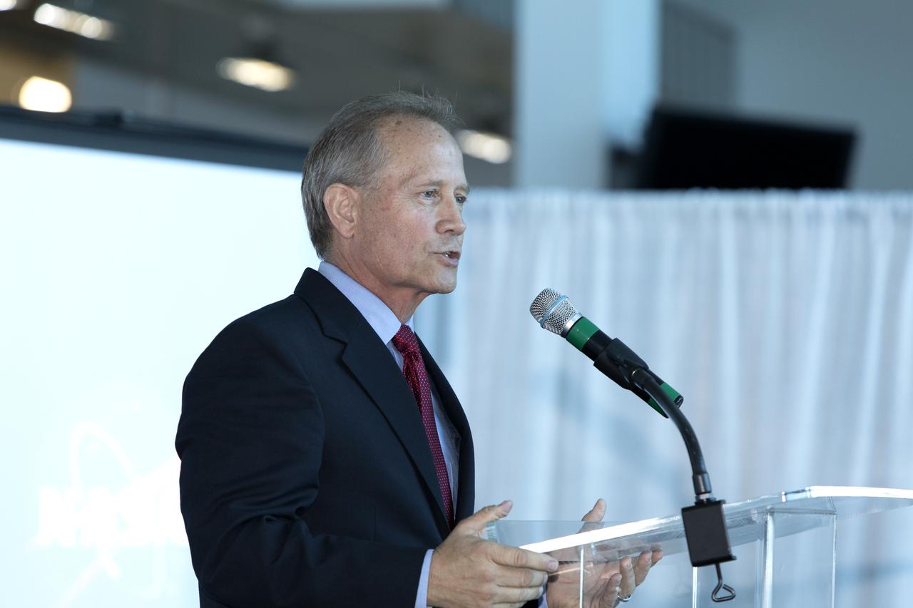 Steve Owens, deputy program manager with a.i. solutions Inc., a contractor at Kennedy Space Center, speaks to attendees at NASA's Business Opportunities Expo 2018, on Oct. 23, inside Cruise Terminal 6 at Port Canaveral in Florida. a.i. solutions signed a Mentor-Protégé Agreement with Red Canyon Software Inc. during the expo. a.i. solutions will be mentor to Red Canyon Software. The 28th Business Opportunities Expo featured more than 200 businesses, large and small, and government exhibitors from throughout the Space Coast and the nation. The Business Opportunities Expo is facilitated by Kennedy's Small Business Programs Office and Prime Contractor Board, along with the U.S. Air Force 45th Space Wing and Canaveral Port Authority. Vendors from a variety of product and service areas, such as computer technology, engineering services, communication equipment and services, and construction and safety products, to name a few, were at the expo. Representatives from the 45th Space Wing, Kennedy prime contractors, NASA and many more agencies and organizations were on hand to provide information and answer questions.