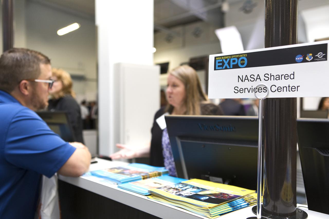 Attendees talk to vendors, such as the NASA Shared Services Center, during the agency's Business Opportunities Expo 2018, on Oct. 23, inside Cruise Terminal 6 at Port Canaveral in Florida. The 28th Business Opportunities Expo featured more than 200 businesses, large and small, and government exhibitors from throughout the Space Coast and the nation. The Business Opportunities Expo is facilitated by Kennedy's Small Business Programs Office and Prime Contractor Board, along with the U.S. Air Force 45th Space Wing and Canaveral Port Authority. Vendors from a variety of product and service areas, such as computer technology, engineering services, communication equipment and services, and construction and safety products, to name a few, were at the expo. Representatives from the 45th Space Wing, Kennedy prime contractors, NASA and many more agencies and organizations were on hand to provide information and answer questions.