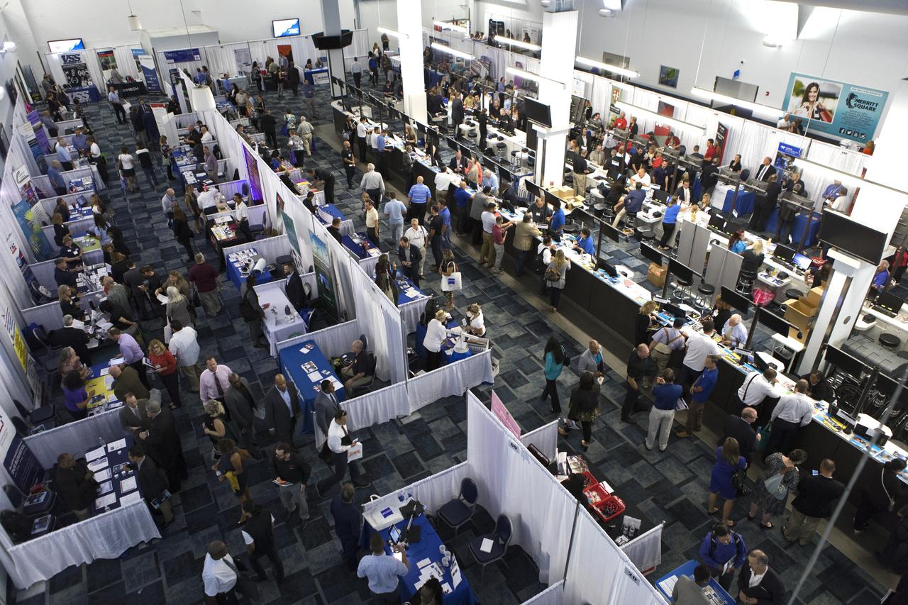 Attendees talk with representatives from a variety of business and government agencies during NASA's Business Opportunities Expo 2018, on Oct. 23, inside Cruise Terminal 6 at Port Canaveral in Florida. The 28th Business Opportunities Expo featured more than 200 businesses, large and small, and government exhibitors from throughout the Space Coast and the nation. The Business Opportunities Expo is facilitated by Kennedy's Small Business Programs Office and Prime Contractor Board, along with the U.S. Air Force 45th Space Wing and Canaveral Port Authority. Vendors from a variety of product and service areas, such as computer technology, engineering services, communication equipment and services, and construction and safety products, to name a few, were at the expo. Representatives from the 45th Space Wing, Kennedy prime contractors, NASA and many more agencies and organizations were on hand to provide information and answer questions.