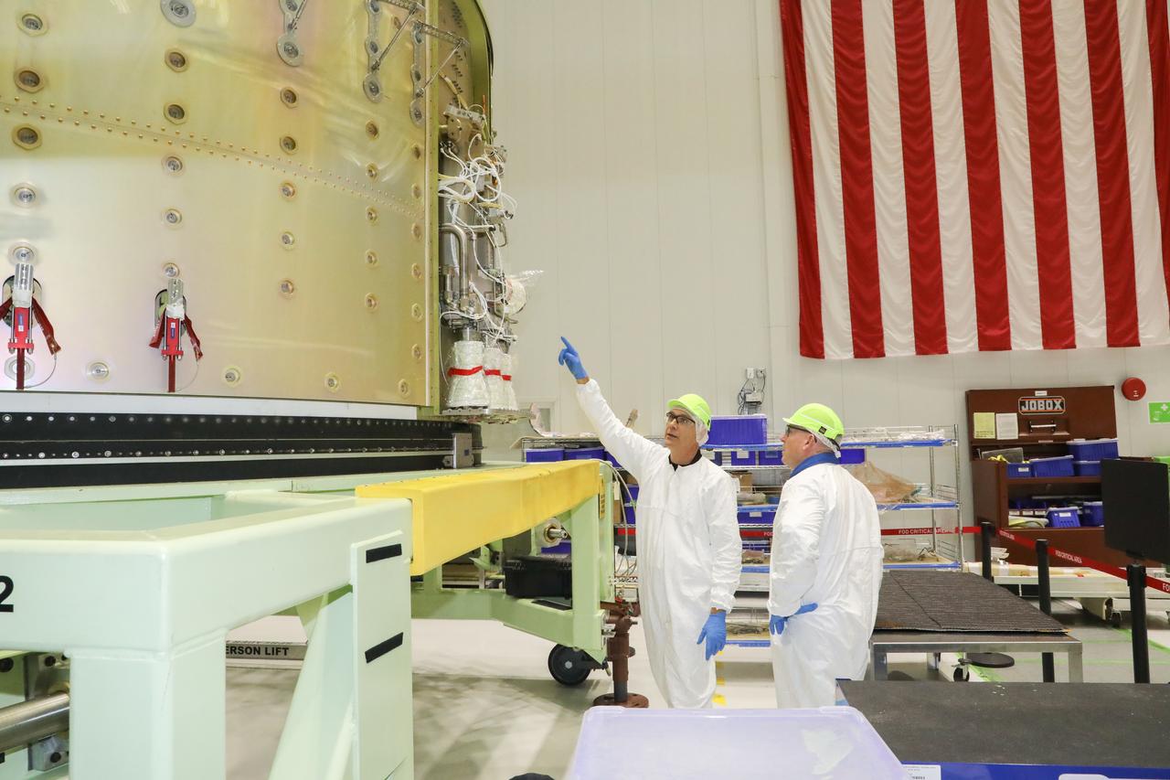 NASA astronaut Barry "Butch" Wilmore, at right, tours Boeing's Commercial Crew and Cargo Processing Facility (C3PF) on Oct. 25, 2018, at NASA's Kennedy Space Center in Florida. Boeing's CST-100 Starliner will launch on its first uncrewed flight test on a United Launch Alliance Atlas V rocket. The Starliner is being developed and manufactured in partnership with NASA's Commercial Crew Program to return human spaceflight capabilities to the U.S.