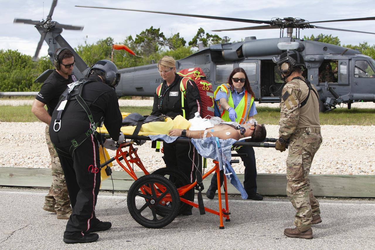 Teams from NASA, the Department of Defense Human Space Flight Support and SpaceX conduct a joint medical triage and medical evacuation (medevac) training exercise at NASA’s Kennedy Space Center in Florida. It was the second of two emergency medical services simulations performed before commercial crew flight tests, which are scheduled for 2019. As NASA’s Commercial Crew Program prepares to begin launching astronauts once again from American soil, teams are sharpening their launch day operations procedures, including responses during the unlikely event of an emergency.