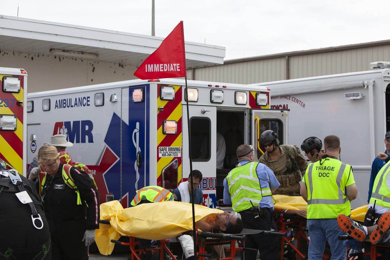 Teams from NASA, the Department of Defense Human Space Flight Support and SpaceX conduct a joint medical triage and medical evacuation (medevac) training exercise at NASA’s Kennedy Space Center in Florida. It was the second of two emergency medical services simulations performed before commercial crew flight tests, which are scheduled for 2019. As NASA’s Commercial Crew Program prepares to begin launching astronauts once again from American soil, teams are sharpening their launch day operations procedures, including responses during the unlikely event of an emergency.