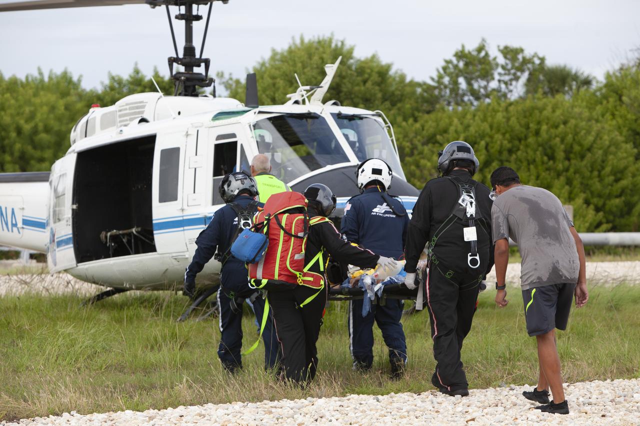 Teams from NASA, the Department of Defense Human Space Flight Support and SpaceX conduct a joint medical triage and medical evacuation (medevac) training exercise at NASA’s Kennedy Space Center in Florida. It was the second of two emergency medical services simulations performed before commercial crew flight tests, which are scheduled for 2019. As NASA’s Commercial Crew Program prepares to begin launching astronauts once again from American soil, teams are sharpening their launch day operations procedures, including responses during the unlikely event of an emergency.